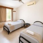 Recámara 3 con dos camas individuales en Villa las Fuentes, Cuernavaca