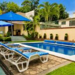 Villas Eucalipto, área de alberca y jardín del conjunto